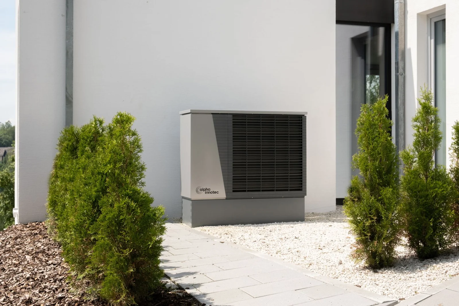 Air conditioning equipment beside a home